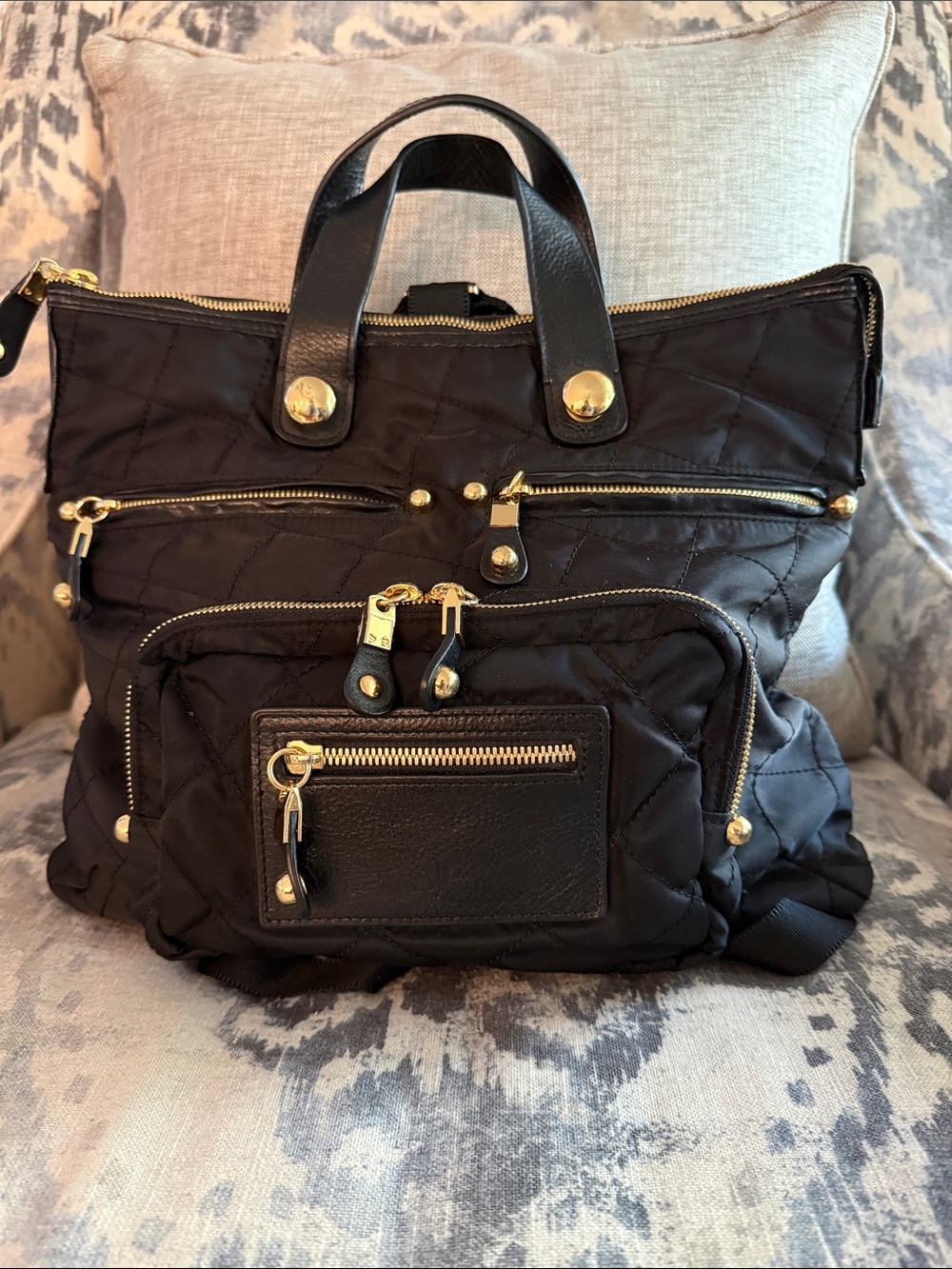 BLVD Black Quilted Backpack Tote with Gold Hardware Accents and black leather